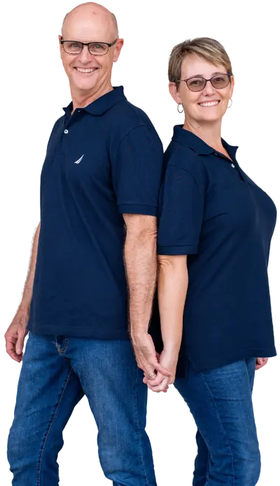 Two professional home buyers in Fort Wayne, IN, standing side by side in branded company shirts, representing a trusted local team offering fast cash offers to motivated home sellers.