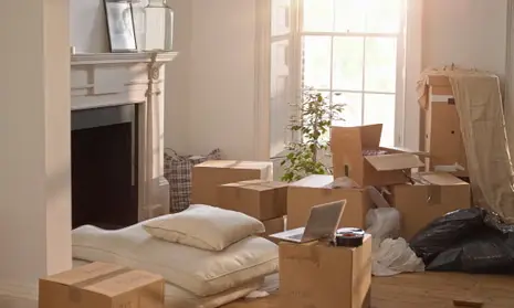 Partially packed home interior with natural light, representing a homeowner considering selling due to health changes or medical costs