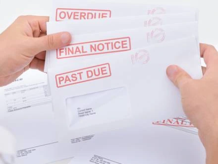 Property tax bill marked past due on a clean desk